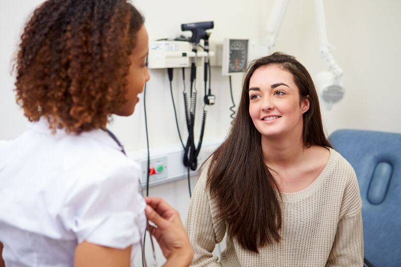 Teen patient talking to provider